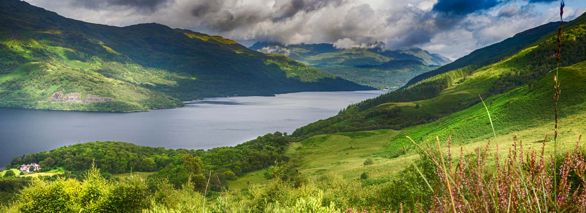 Scenic view of Loch Lomond and Scottish Highland mountains — Scotland — The Grand Britannia motorcycle tour — Wild Roads