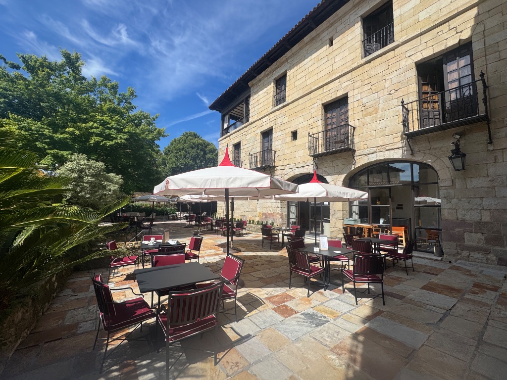 Sunny flagstone terrace Parador de Gil Blas Santillana del Mar Cantabria — Picos & Pyrenees May 2026