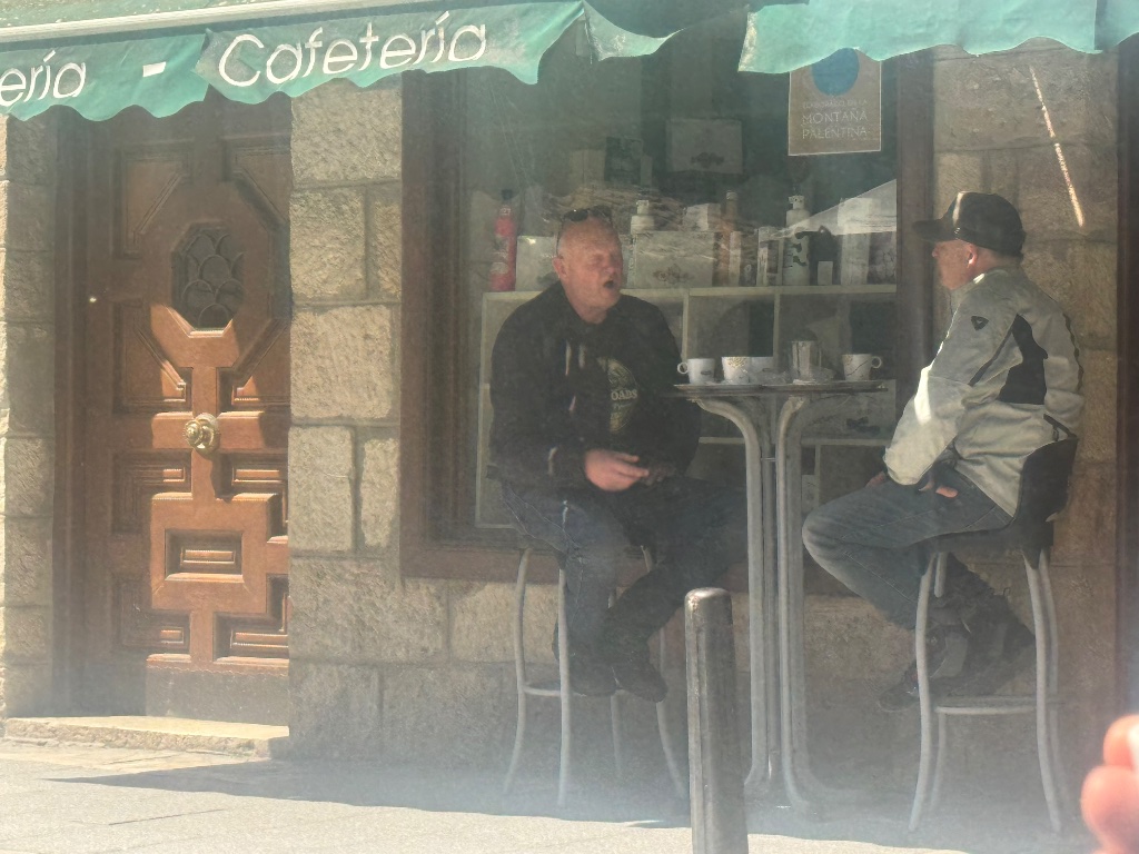Two Wild Roads riders at Cafetería Montaña Palentina — northern Spain coffee stop — Picos & Pyrenees May 2026