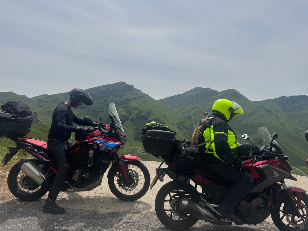 Honda Africa Twin and Honda CB500X at Pyrenean mountain pass viewpoint — Picos & Pyrenees May 2026