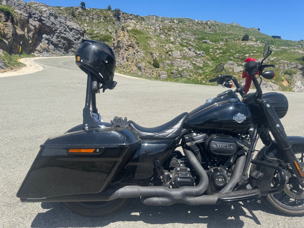 Harley-Davidson Road King Special parked on Pyrenean mountain pass — blacked out exhaust — Wild Roads May 2026