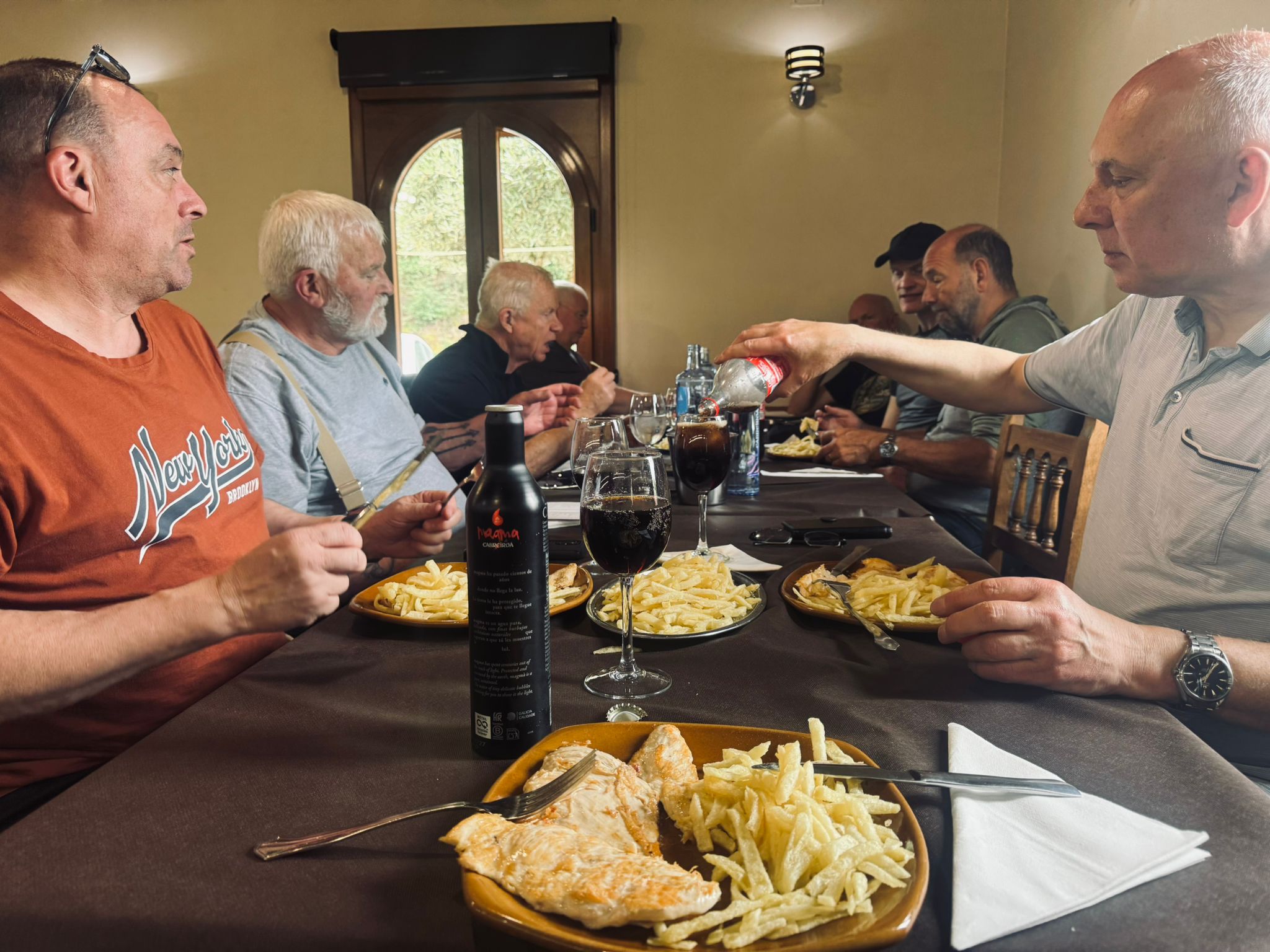 Group lunch table Galicia Wild Roads Tour — grilled chicken chips and wine