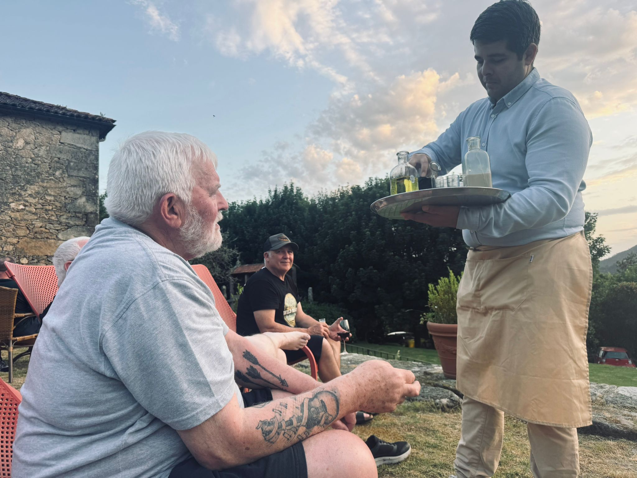 Evening drinks served on terrace Wild Roads Tour Galicia farmhouse