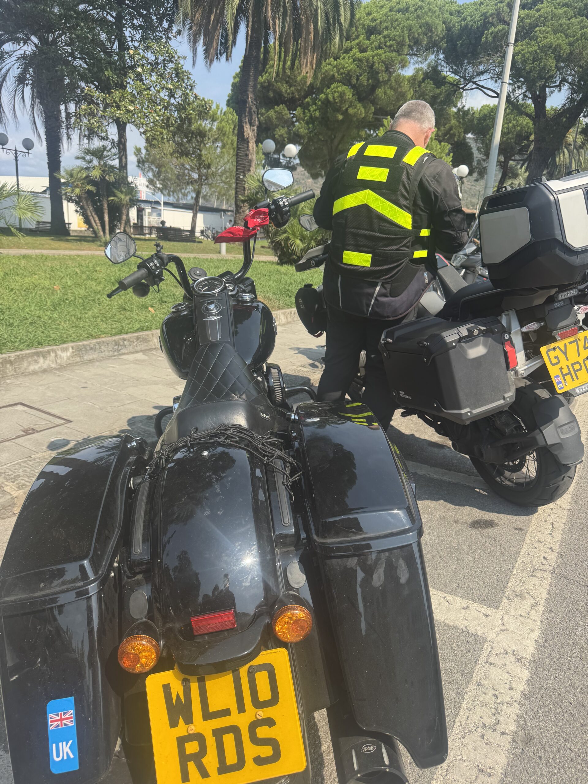 Riders preparing their motorcycles in the sunshine at Sestri Levante