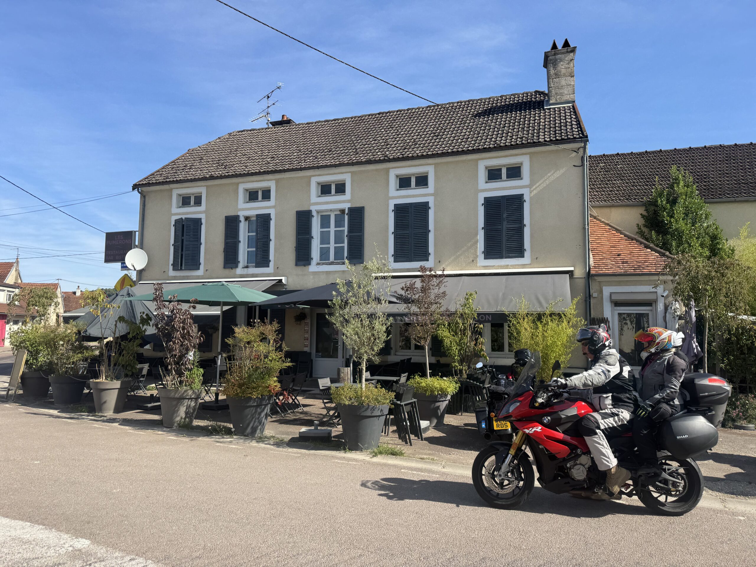 Morning coffee and motorcycles parked at 1 Rue de Valverset before Day 14 departure