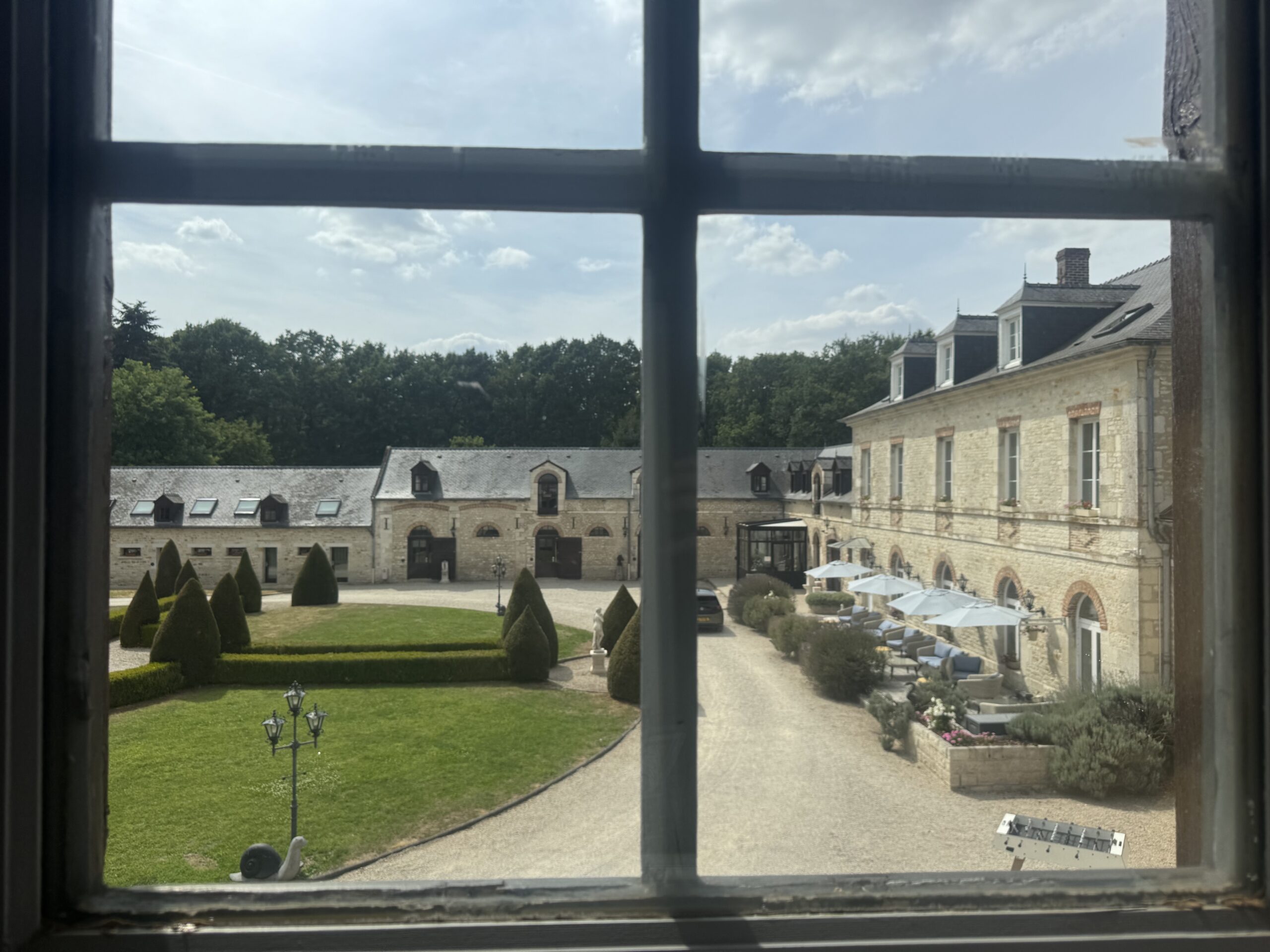 Relaxing in the courtyard at Domaine de Barive after a day of riding across France