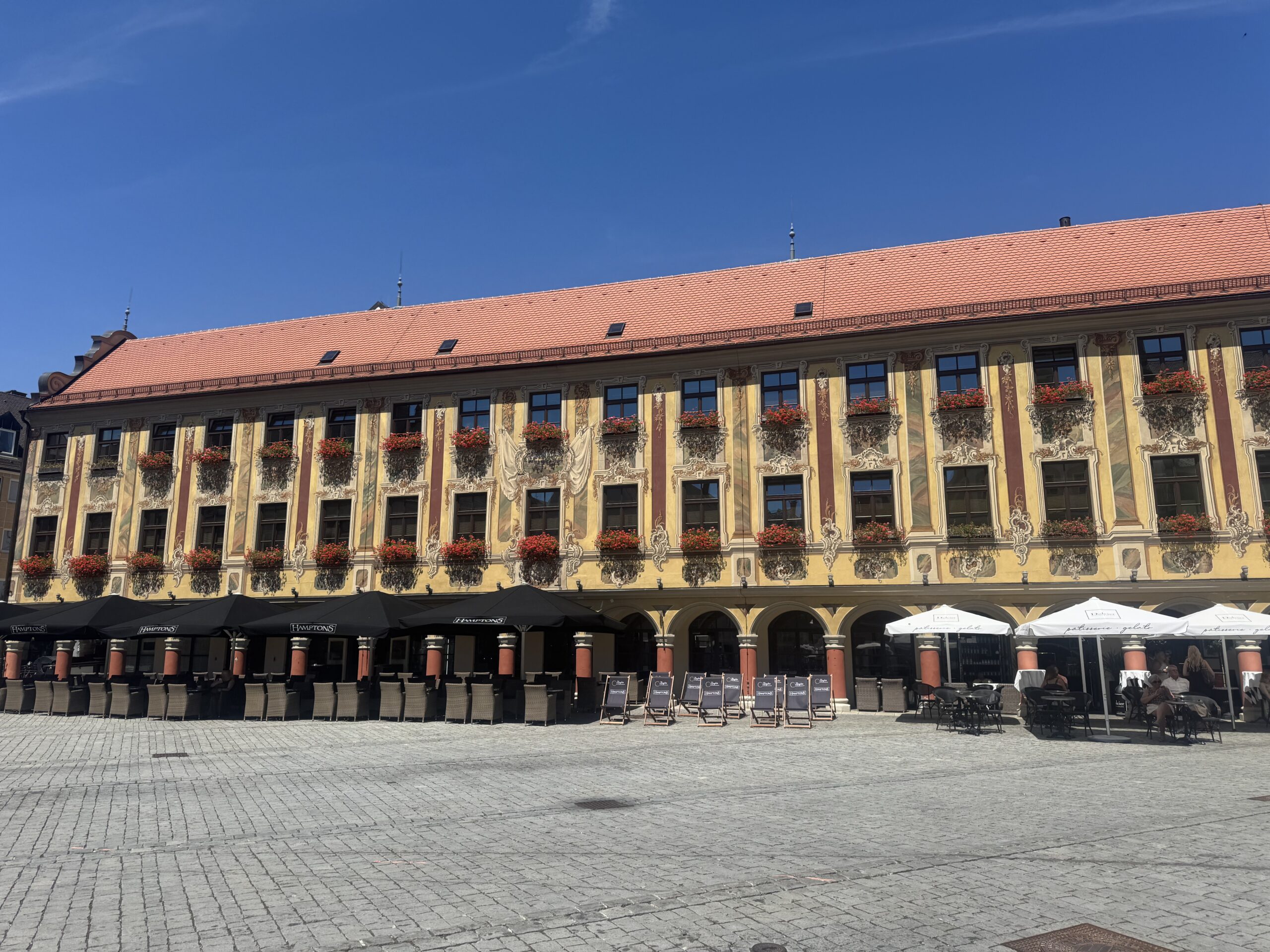 Historic colorful gabled buildings in Marktplatz Memmingen — Twisties & Tuscan Sun July 2026