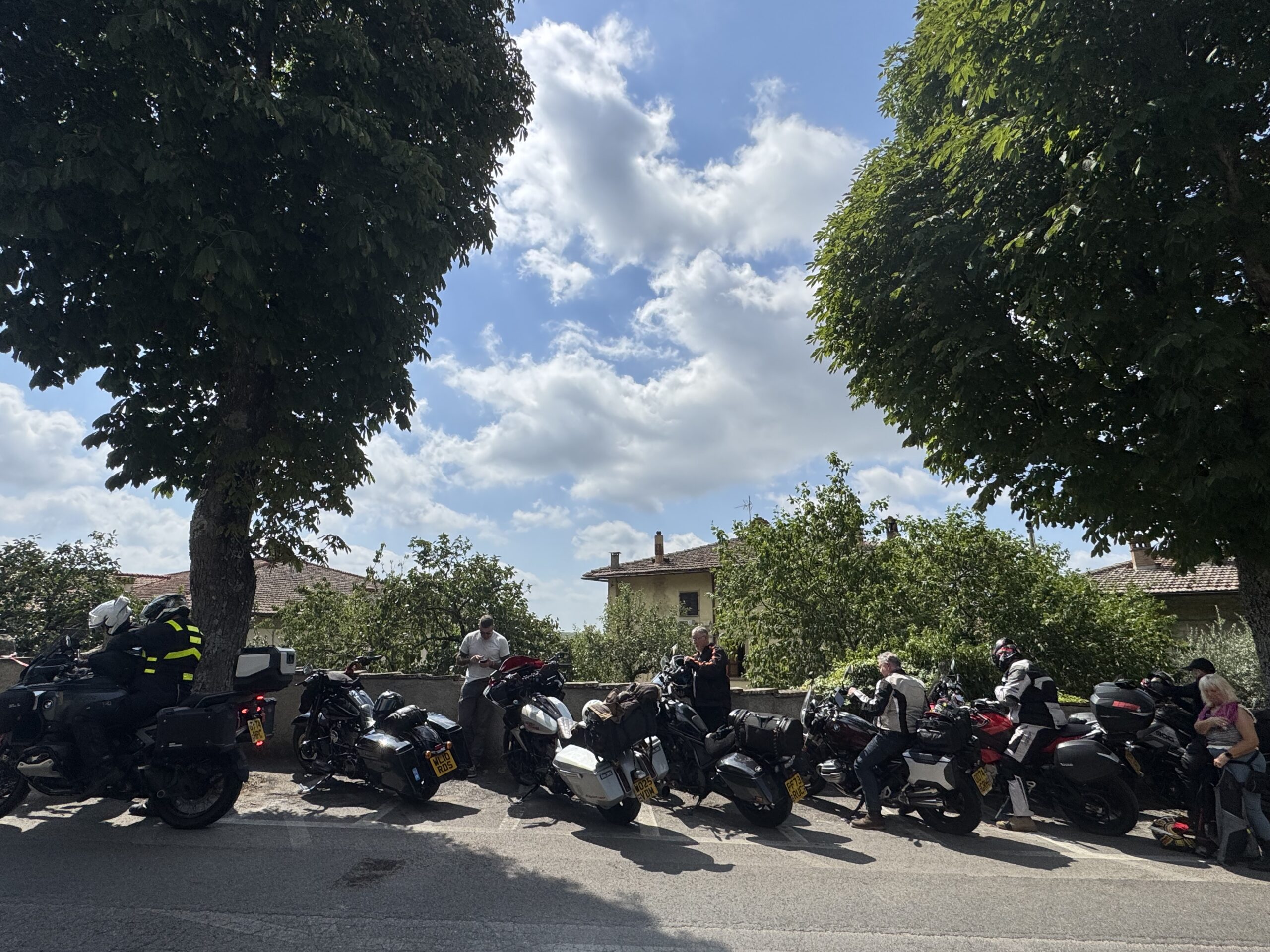 Rolling into Radda in Chianti with cypress trees and vineyard hairpins