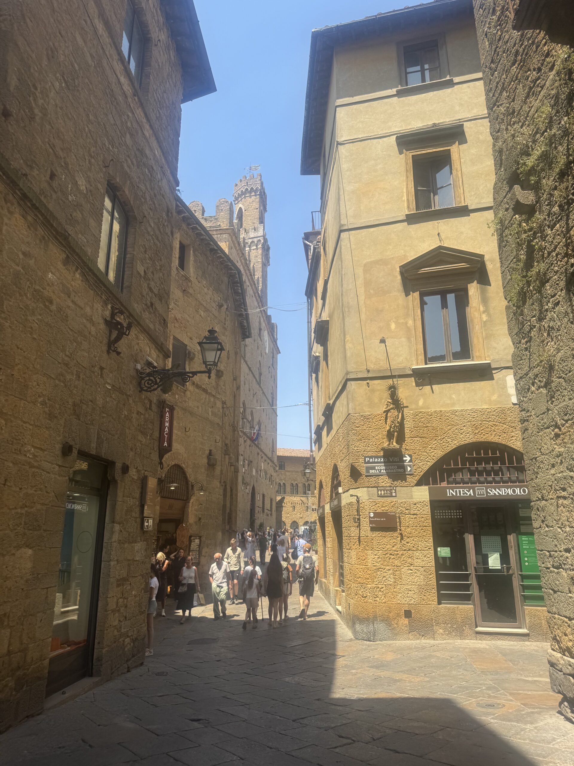 Ancient stone architecture and narrow historic streets inside medieval Volterra