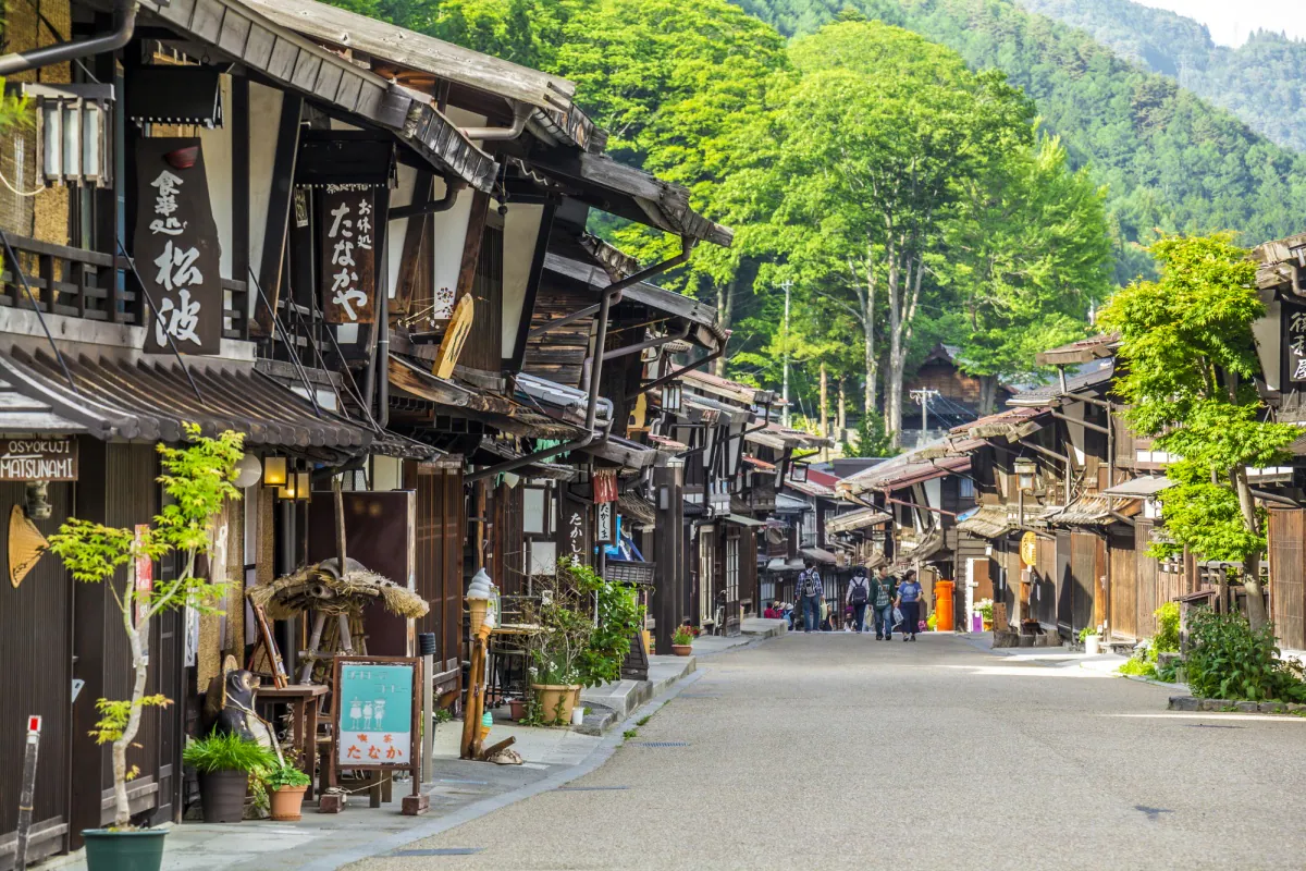 Historic wooden buildings lining the old Nakasendo post road at Narai-juku — hidden Japan motorcycle expedition — Wild Roads