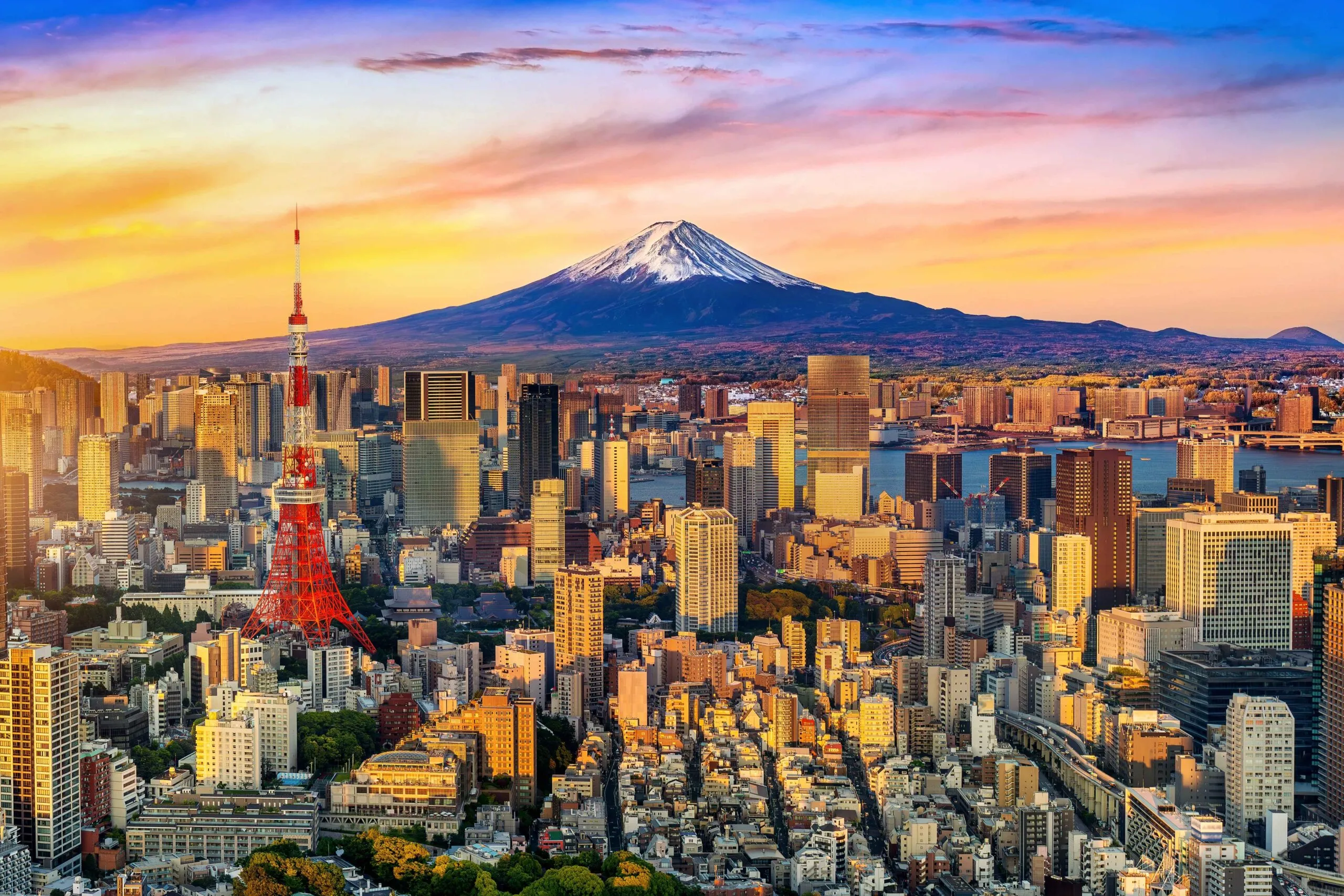 Tokyo skyline with Tokyo Tower and Mount Fuji at sunset — hidden Japan motorcycle expedition — Wild Roads